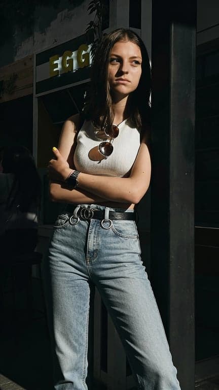 Complete the person’s full body by extending the original image with realistic anatomy, stable footing, and continuous pose flow. Avoid altering identity, outfit, or environment, focusing only on proportional and physically believable body completion.