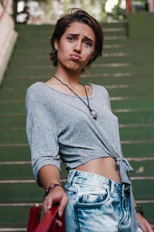 generate a stylized sad expression designed to feel playful and shareable, clearly separating it from natural sadness through bold exaggeration