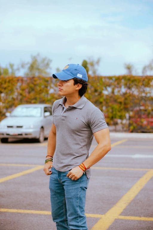 a portrait of a person converted into a Looney Tunes-style cartoon character, featuring extreme facial exaggeration, expressive gestures, elastic squash-and-stretch body shapes, strong black outlines, smooth painted cel shading, lively animation posing, and a timeless vintage slapstick cartoon aesthetic.