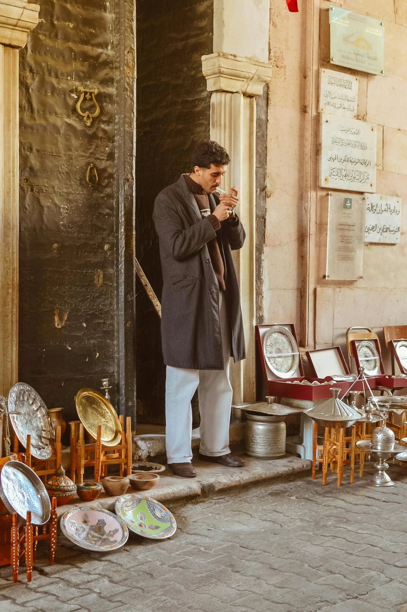 a portrait of a person edited with a white Hollow mask forming over one side of the face, with dark energy swirling around