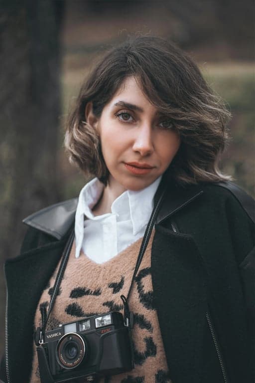 a portrait of a person enhanced with vintage 70s fashion styling, classic flared shapes, straight or slightly fitted tops, clear garment structure, balanced proportions, calm posture, and clean nostalgic backdrop