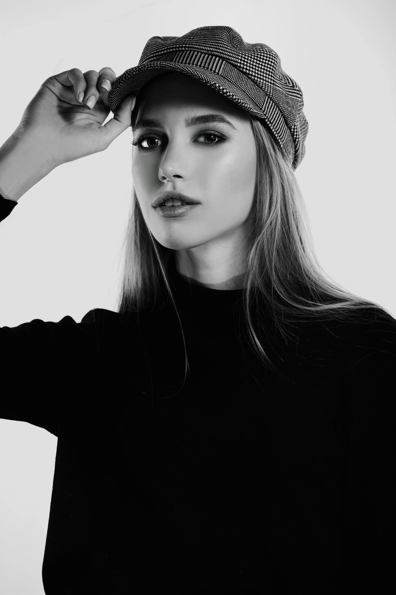 Chic Style filter before photo - neutral portrait in basic top against plain wall