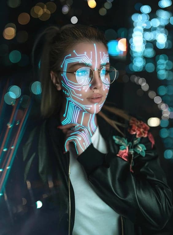 a portrait of a person where neon circuit board patterns glow beneath their skin, creating a high-tech biomechanical aesthetic