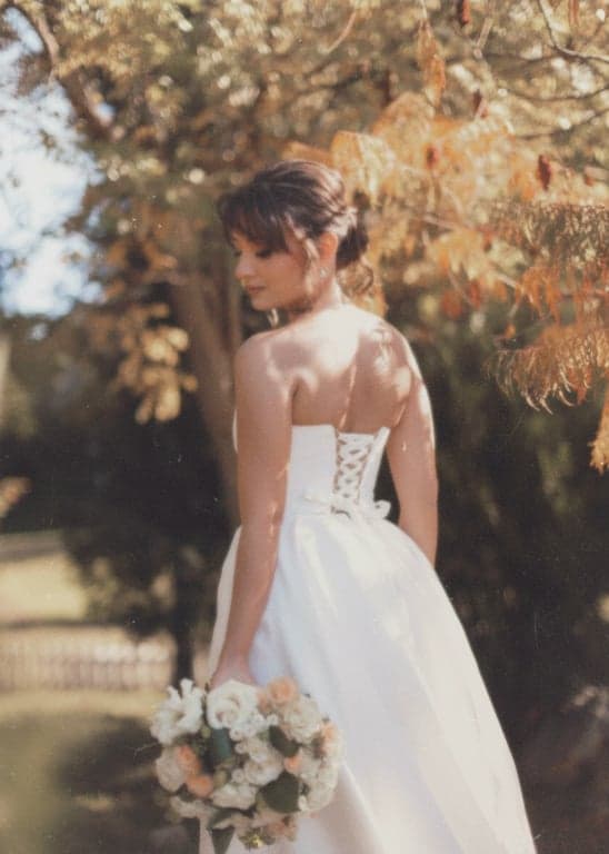 a portrait of a person enhanced with classic old camera characteristics, including blur, grain, and faded contrast