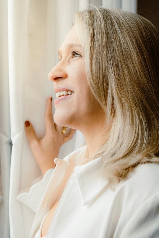 a portrait of a woman transformed into stardew valley pixel art, simplified features, warm color palette, charming and rustic vibe.