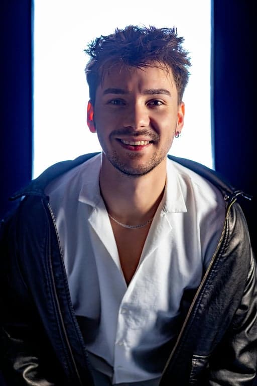 A portrait transformed into Peter Griffin's style, featuring a prominent bald head with three hairs, a thick neck, and a simple collared shirt, cheerful expression.