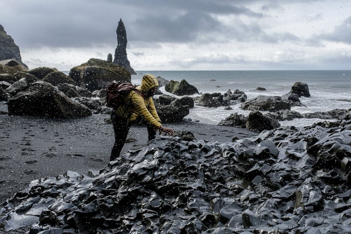 create a winter atmosphere by combining falling snow with subtle haze, cooler color temperature, and soft contrast adjustments without overpowering the original photo