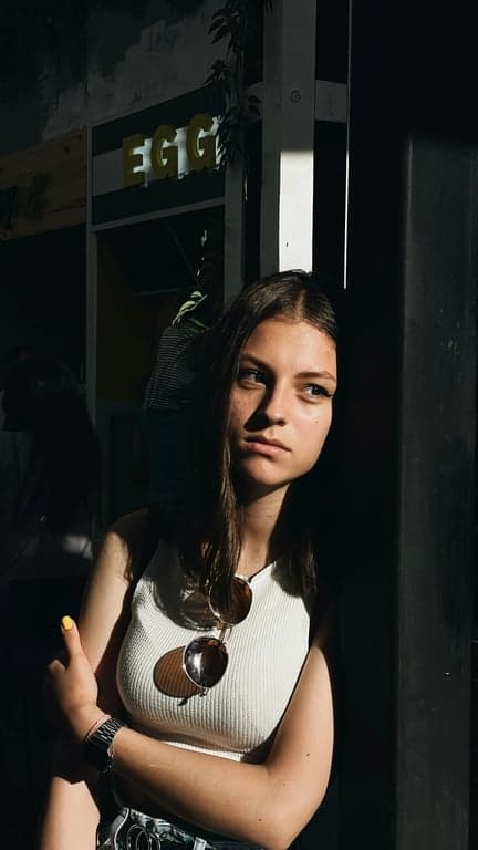 Complete the person’s full body by extending the original image with realistic anatomy, stable footing, and continuous pose flow. Avoid altering identity, outfit, or environment, focusing only on proportional and physically believable body completion.