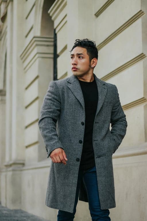 A portrait with an 80s grain filter applied, emphasizing the texture of the grain to mimic ISO 400 film, with slightly washed-out colors and a soft, dreamy quality.