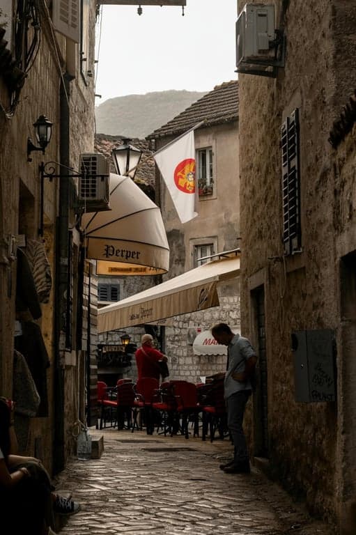 A flag representing a fusion of two cultures: seamlessly blending the layout and iconic symbols from two existing national flags into a new, cohesive design.