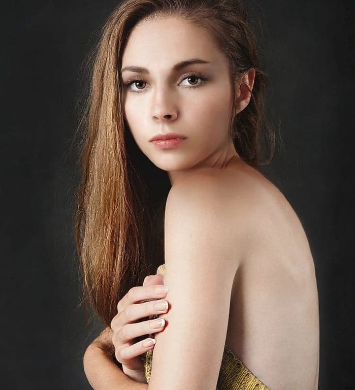 ai eye contact correction after photo - woman with long hair corrected to look directly at the camera