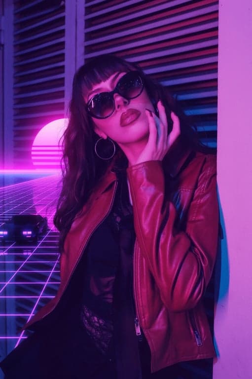 a portrait of a person in a Vaporwave Outrun filter, with deep purple and blue hues, neon grid lines, and a vintage sports car silhouette