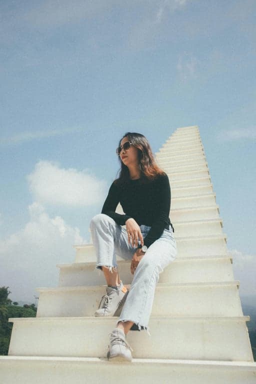 transform the photo into a strong dating app profile image by improving facial light distribution, refining jawline definition, enhancing eye clarity, correcting posture and framing, reducing distracting objects in the background, maintaining natural skin texture and realistic detail, and producing a result that looks intentionally selected for first impressions