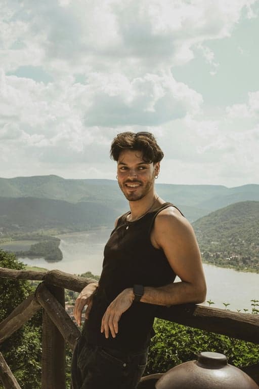 a portrait of a person transformed into a high-quality avatar with intentional stylization, realistic facial balance, smooth light transitions, minimal background elements, and a crisp digital illustration look