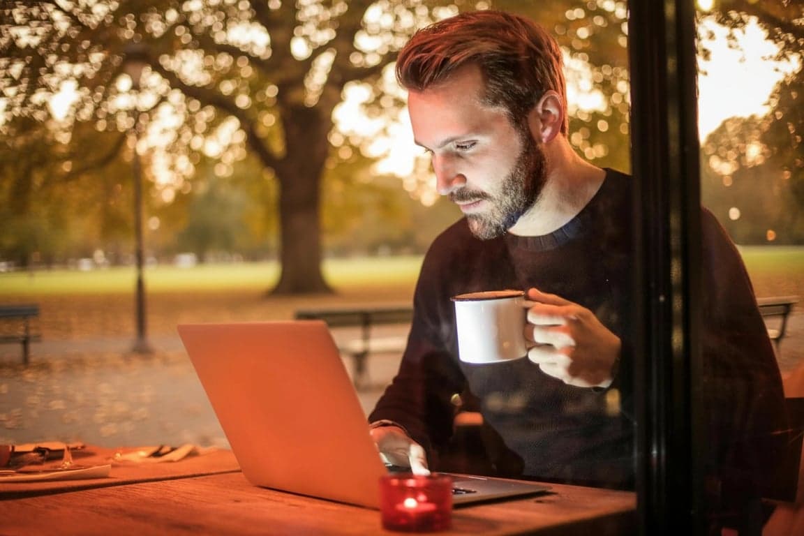 a portrait of a man, realistic background replacement, matching lighting and shadows, natural perspective, outdoor park setting.