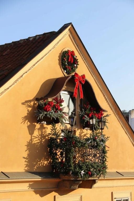 Christmas photo editor after photo - an attic bathed in sunlight with Christmas decoration