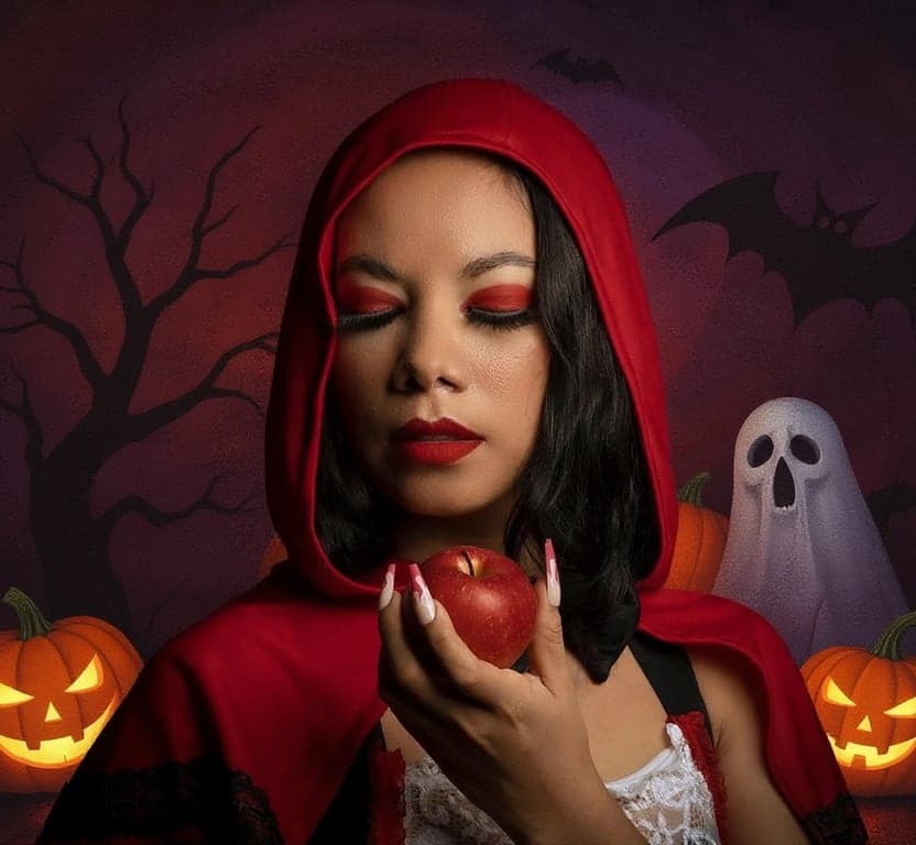 ai Halloween background after pic-woman holding apple with Halloween background
