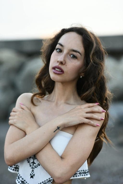 a D&D magic-user character illustrated with clear spellcaster identity, layered robes or arcane clothing, subtle magical effects, controlled glowing elements, and a serious fantasy illustration style that avoids exaggerated visual effects