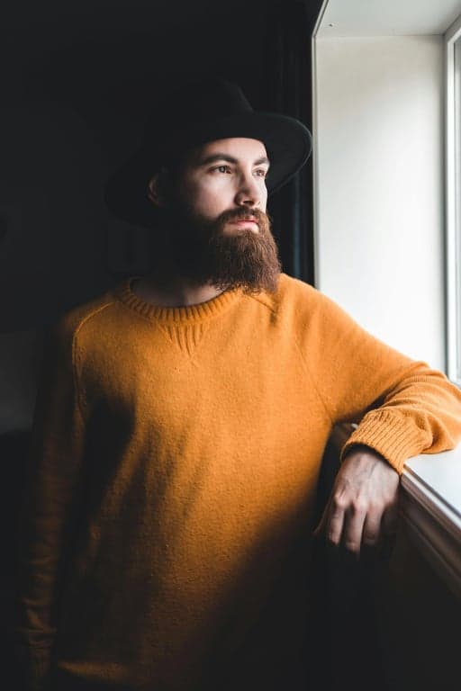 create a sad face with deliberately amplified emotional cues, such as enlarged eyes, exaggerated brow angles, and stretched mouth shapes, optimized for social media reaction images