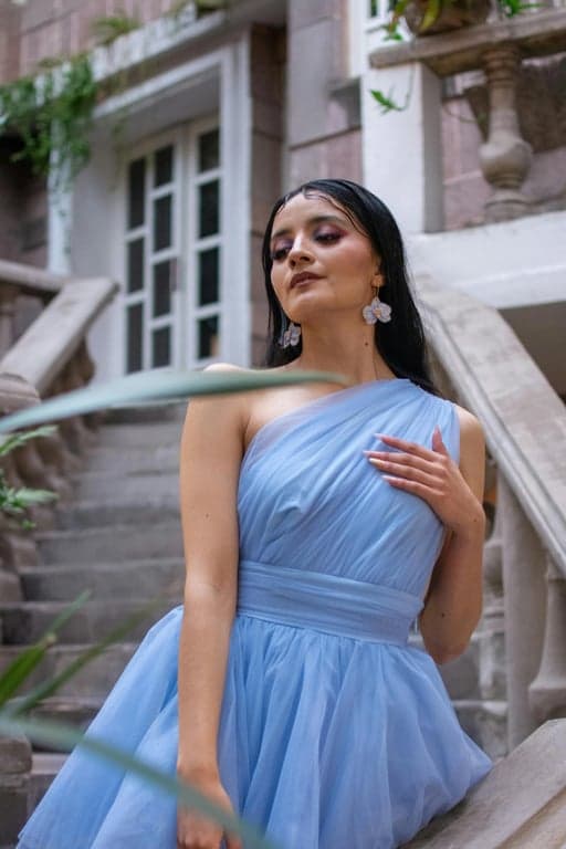 Turn the original person into a Hello Kitty parallel world sticker character with a cat face. Use an exaggerated head-to-body ratio, bold outlines, flat pastel colors, and a simple cut-out composition with minimal background, suitable for stickers or emoji-style assets.