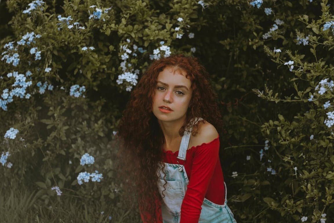 a portrait of a person cleaned of random lens flare and harsh shadow noise, while preserving balanced facial lighting and realistic depth