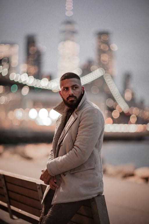 a portrait of a person illustrated in a distinctly American art style, featuring confident frontal framing, strong visual structure, bold color decisions, and the unmistakable look of classic American posters and editorial illustrations