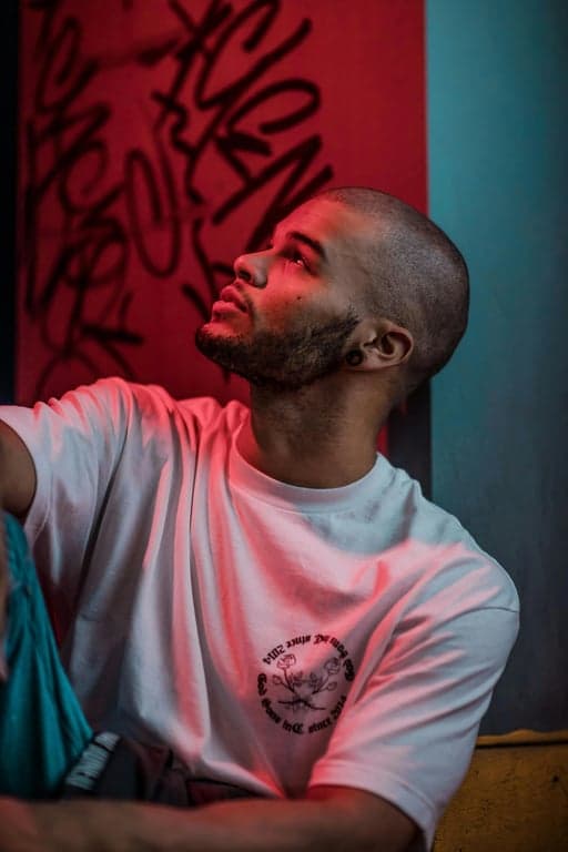 a portrait of a person firing a rapid Energy Volley, with multiple bright ki blasts shooting from the hands