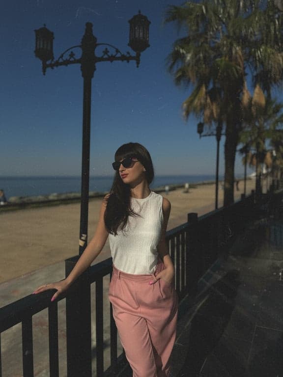 A landscape photo given a retro travel slide aesthetic, with fine grain, faded blues and greens, and a slight blur to mimic a cheaper camera lens.