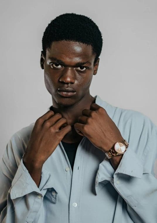 a portrait of a person reimagined in a Japanese anime battle art style with strong line contrast, expressive posture, and traditional anime outfit structure