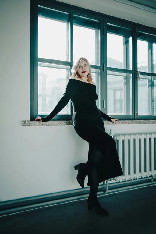 a portrait of a person transformed to create an extreme waist slimming effect by heavily compressing the waist horizontally and leaving hips untouched, resulting in a strikingly narrow waist and a highly visible curvy outline