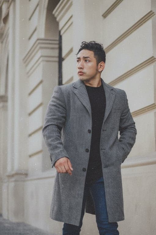 A portrait with an 80s grain filter applied, emphasizing the texture of the grain to mimic ISO 400 film, with slightly washed-out colors and a soft, dreamy quality.