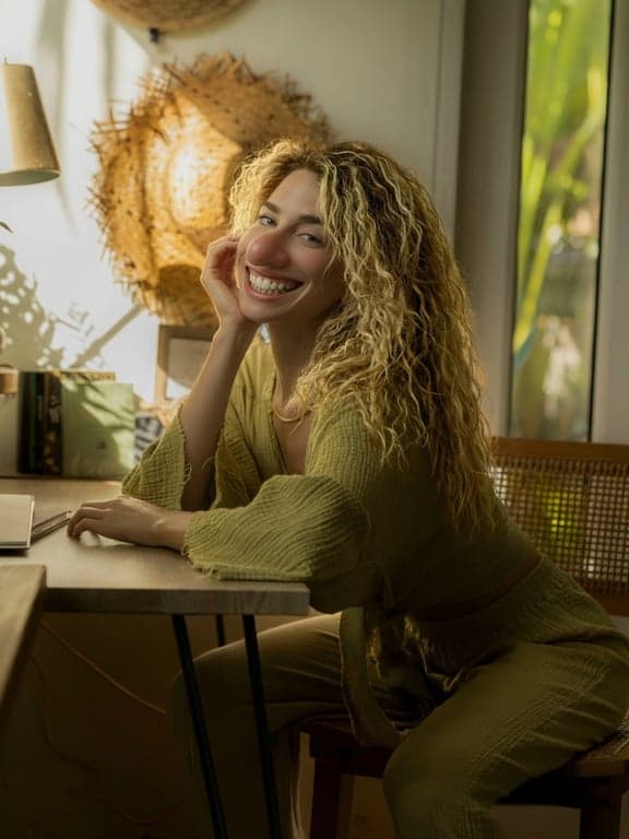 AI ugly filter after photo- woman with golden hair with exaggerated facial expression