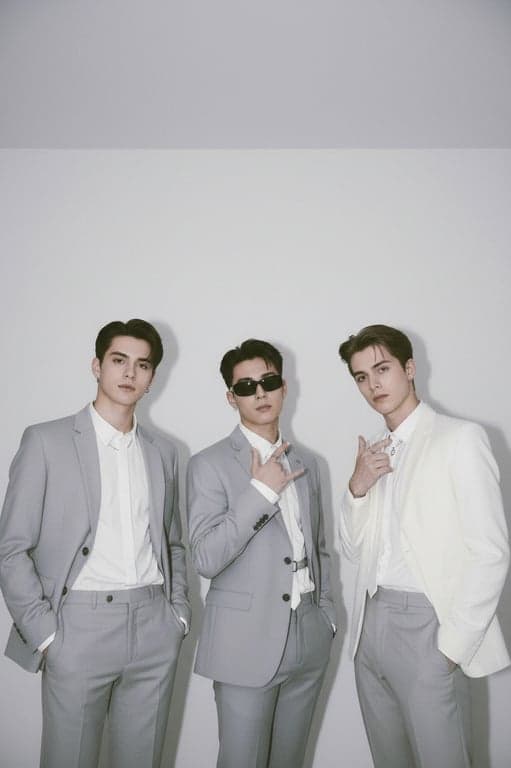 a portrait of a male group transformed into a clean K-pop boy group look, using simple tailored outfits, consistent proportions, minimal accessories, neutral color palette, upright posture, and uncluttered background