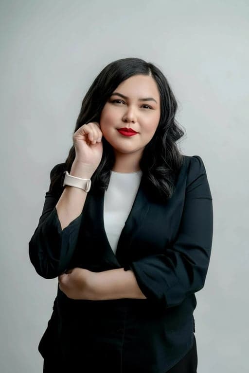 a portrait of a person edited to transform a square face into a narrower and longer face shape by strongly reducing jaw width, removing sharp jaw angles, compressing the face horizontally, and creating a slimmer lower face silhouette while keeping all facial features unchanged