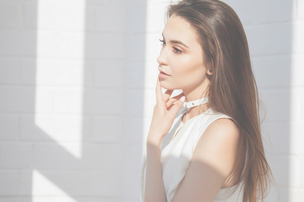 a portrait of a person mimicking an overexposed film shot, with washed-out highlights, soft details, and a dreamy atmosphere