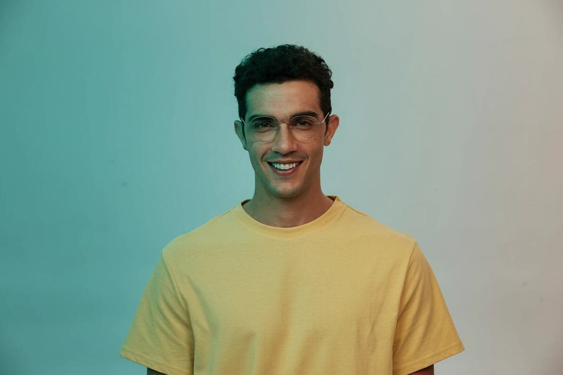 a portrait of a man, cinematic high contrast, teal and orange undertones, dramatic lighting, shallow depth of field.