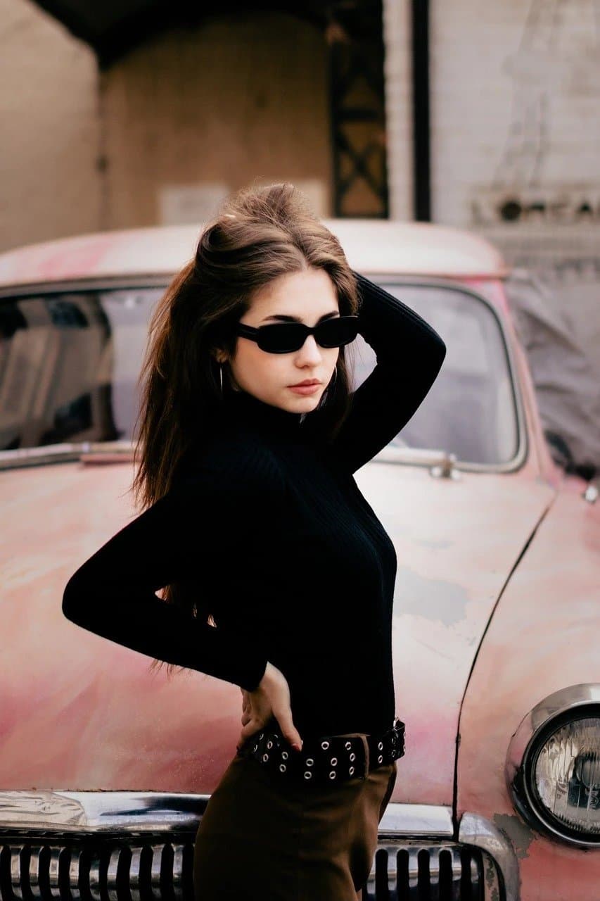 A photo of a person wearing a jacket or coat in neutral colors.