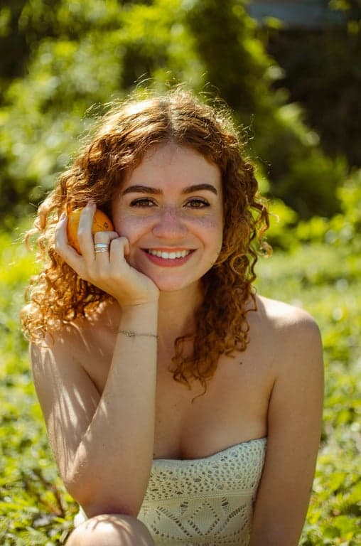 a portrait of a person enhanced with pink hair color while keeping natural texture, scalp transitions, and hairline integrity