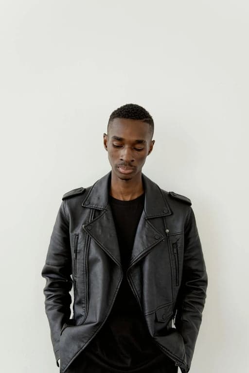 a portrait of a person styled with vacation summer outfit elements, flowing dresses or relaxed shirts and shorts, lightweight fabrics, open silhouettes, warm sunlit tones, relaxed confident posture, and airy background