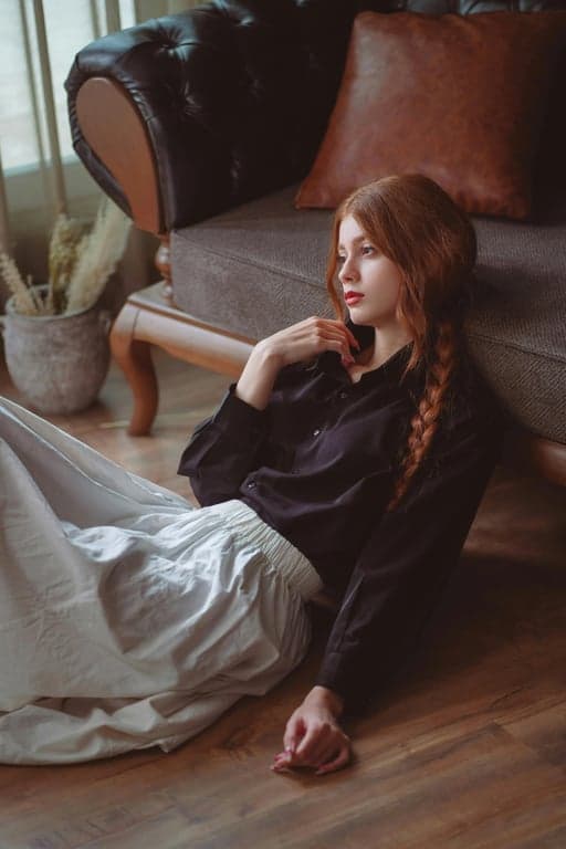 a portrait of a person illustrated in a classic DC comic book style with heavy ink linework, sculpted facial planes, strong light-and-shadow separation, limited color palette, dramatic highlights, and a serious heroic tone typical of DC Comics