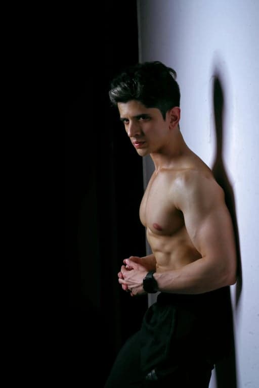 anime tattoo before photo - man standing against the wall