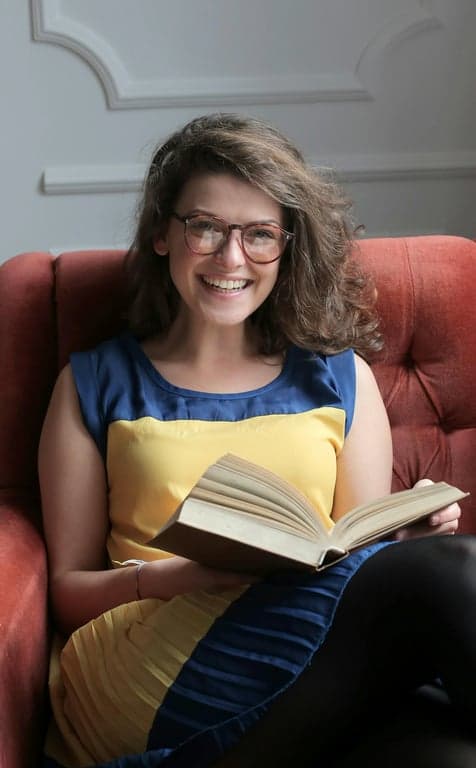 a portrait of a person illustrated in a classic pop art aesthetic emphasizing color separation, simplified facial geometry, thick graphic lines, and print-like visual impact