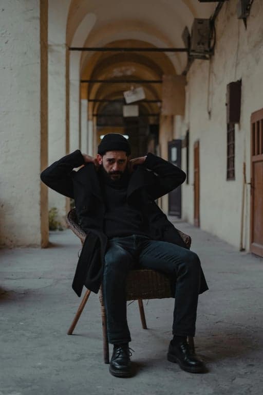 a portrait of a person transformed into a spider hero mid-action, wearing a spider suit, one arm extended shooting web strands, body angled dynamically as if swinging through the city, motion blur accents, dramatic lighting, and high-energy superhero feel