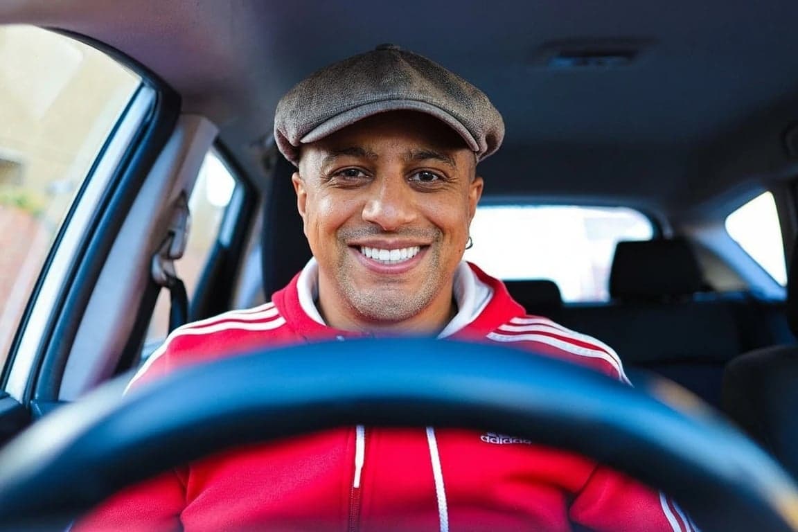 AI teeth whitening filter after photo - young man behind steering wheel smiling with white teeth
