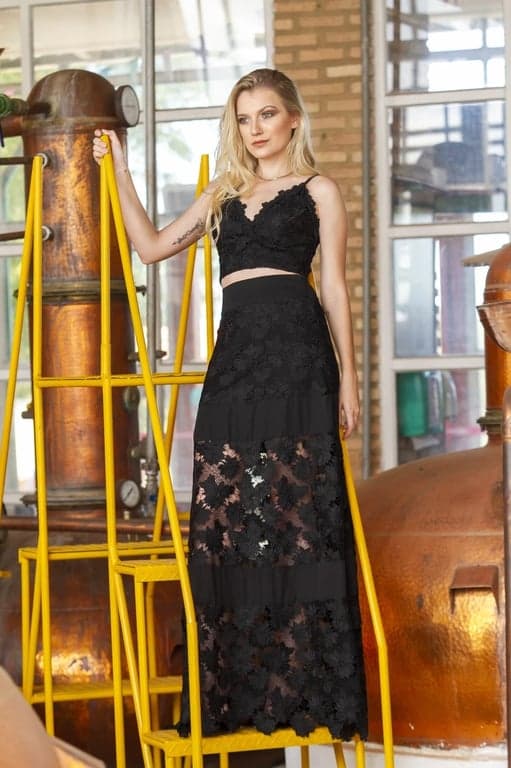 a portrait transformed into a holographic rave party outfit with vibrant multi-color glows and energetic atmosphere