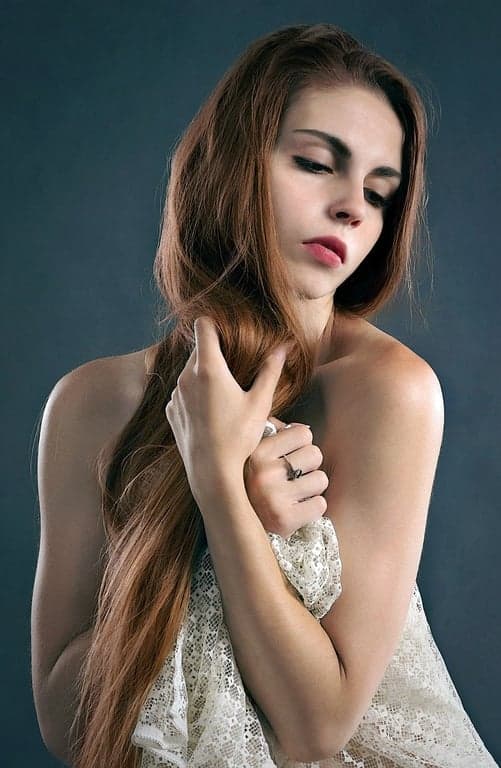 ai eye contact correction before photo - woman portrait with green background