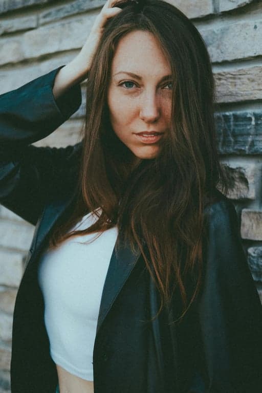 a portrait of a person rendered in a modern Marvel Comics illustration style featuring refined ink outlines, muscular but stylized anatomy, dramatic light-and-shadow separation, saturated comic colors, and a polished graphic novel look