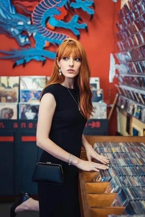 Holiday party outfit after image - person in a timeless little black dress with subtle jewelry