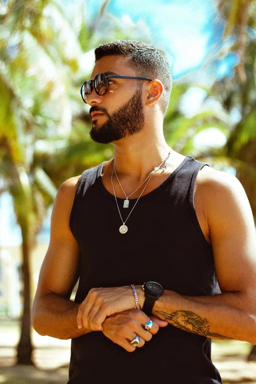 a portrait of a person reimagined in a high-contrast pop art style with poster-like color separation, bold facial outlines, flat color fills, graphic highlights, and a clearly recognizable pop art print appearance