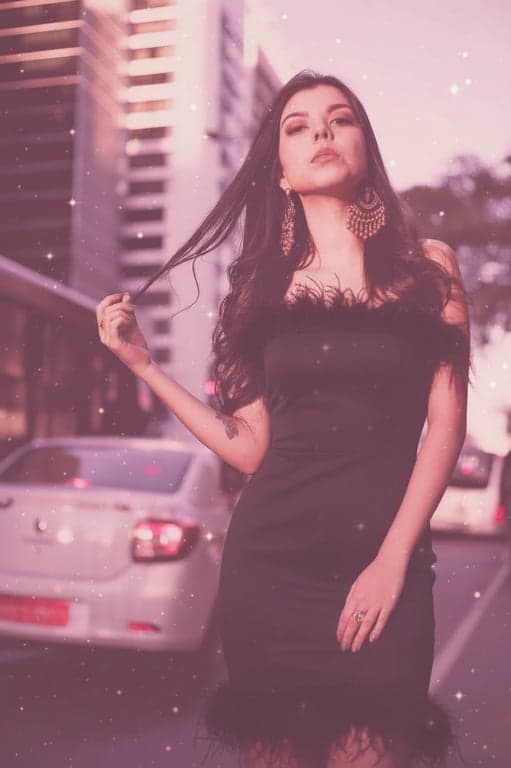 a portrait edited into a feather-trimmed cocktail dress with a soft pink aesthetic and dreamlike party sparkle